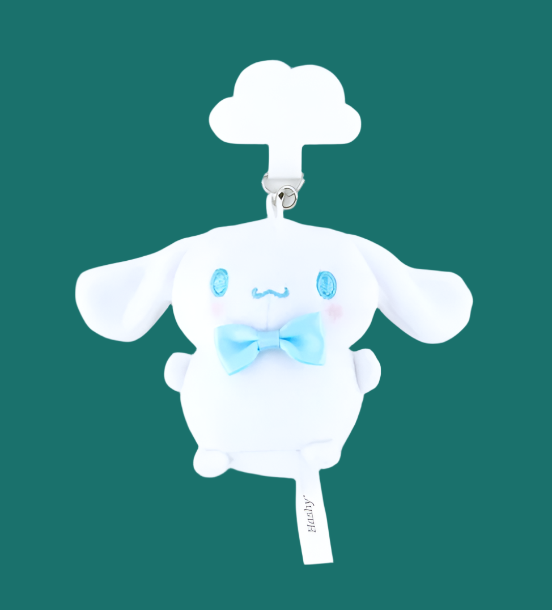 Close-up of the adorable Cinnamoroll plush mascot, designed with a holder sheet for easy attachment to phone cases or chains